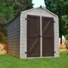 Palram Canopia Skylight Shed 6x8 Tan on lawn with trees in background